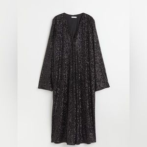 Beautiful long black sequined dress, NWT. Long sleeved, oversized.